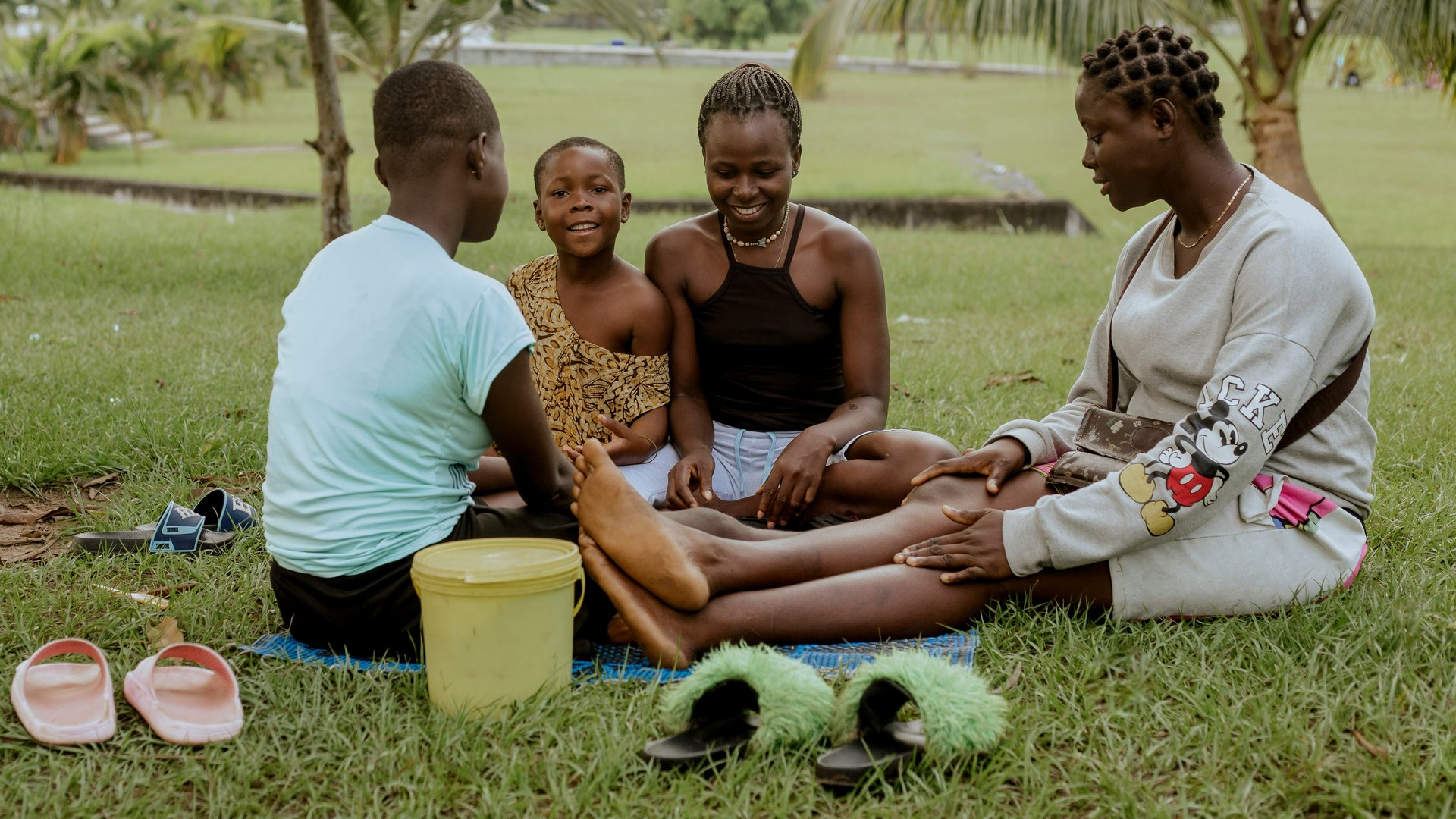 A family standing outside near trees